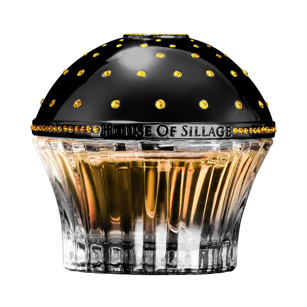 Oriental Parfume with Swarovski Crystals next to book 